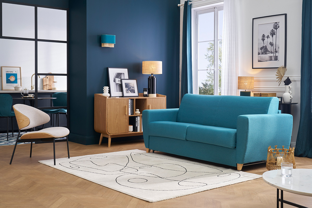 Canap� convertible bleu canard 3 places, vue de face, dans un salon moderne.