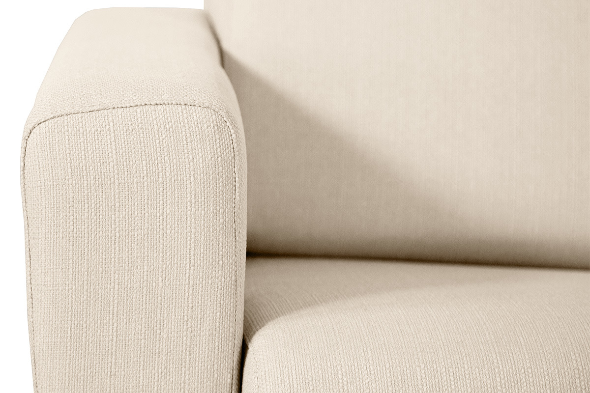 Canap� convertible beige en tissu, focus sur accoudoir.