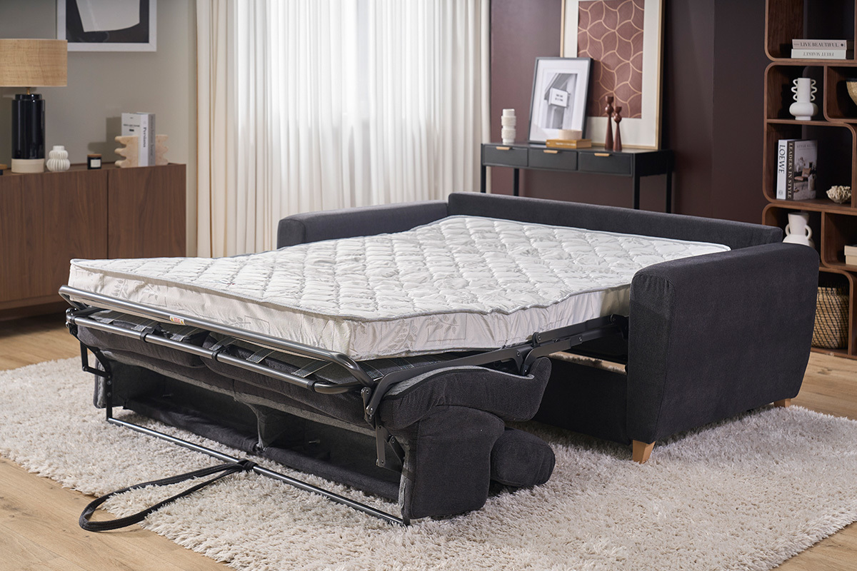 Canap� convertible gris anthracite avec matelas ouvert, vue de c�t�, t�ti�res ajustables.