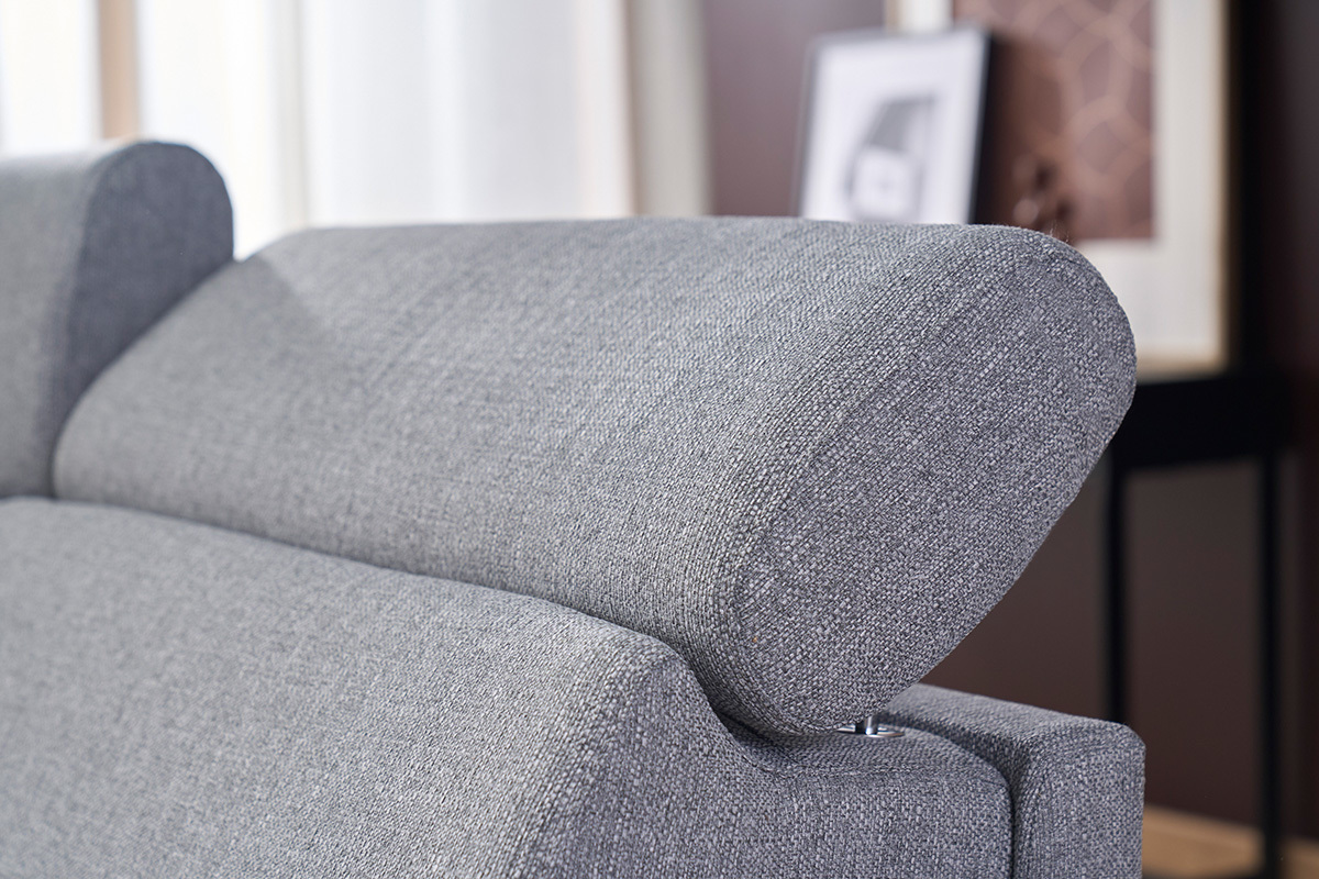 D�tail d'un canap� convertible gris avec t�ti�res ajustables vues de pr�s.
