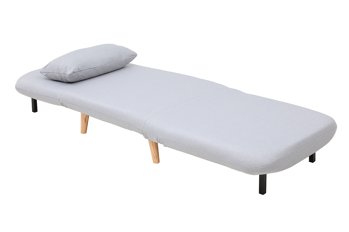 Fauteuil convertible AMIKO en position lit, tissu gris clair et pieds en bois clair.