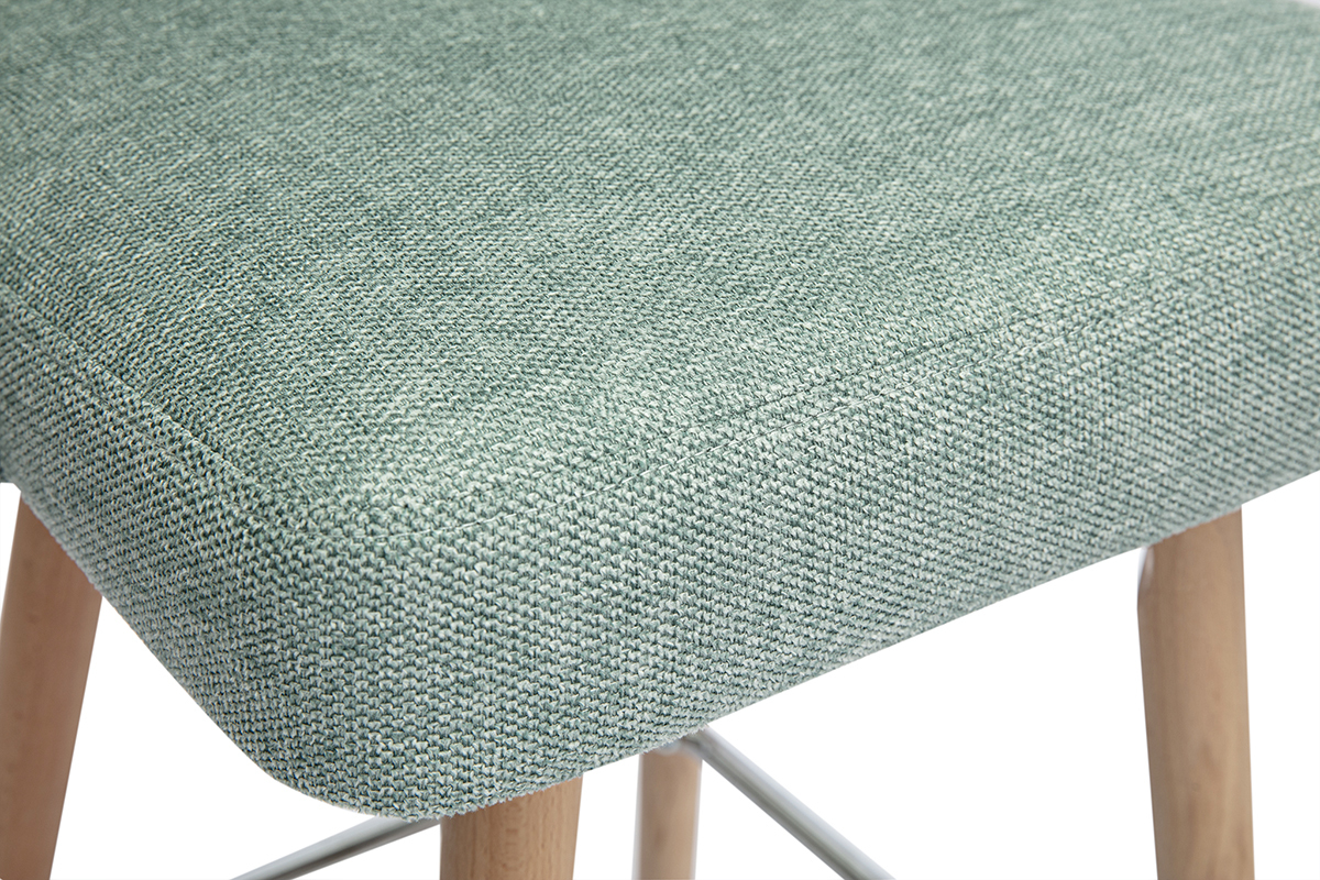 Assise en tissu vert c�ladon textur� du tabouret sur pieds en bois.